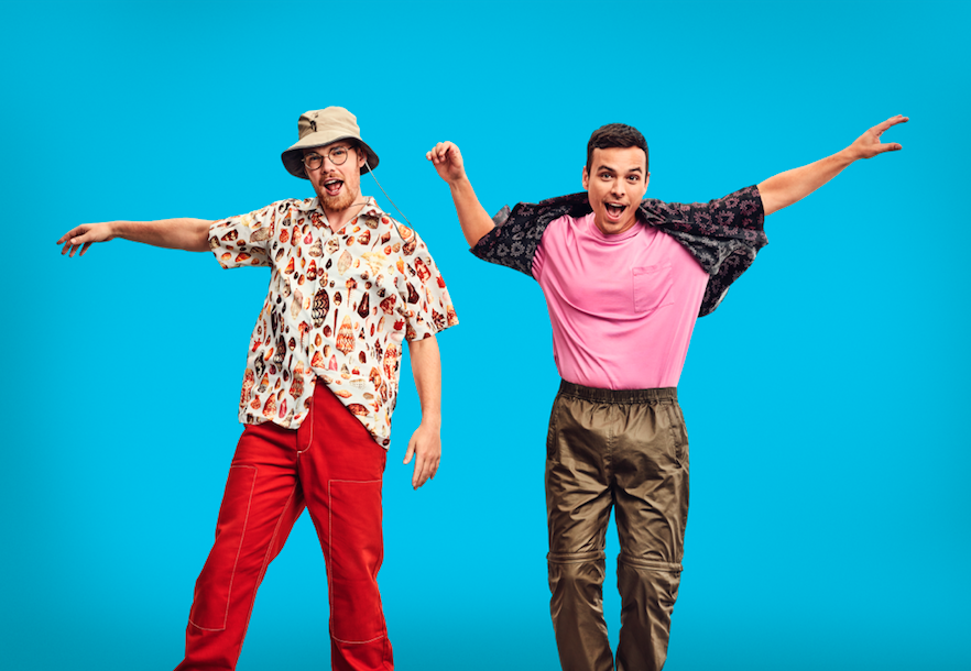 AsapSCIENCE duo Greg Brown and Mitchell Moffit jumping up against blue background