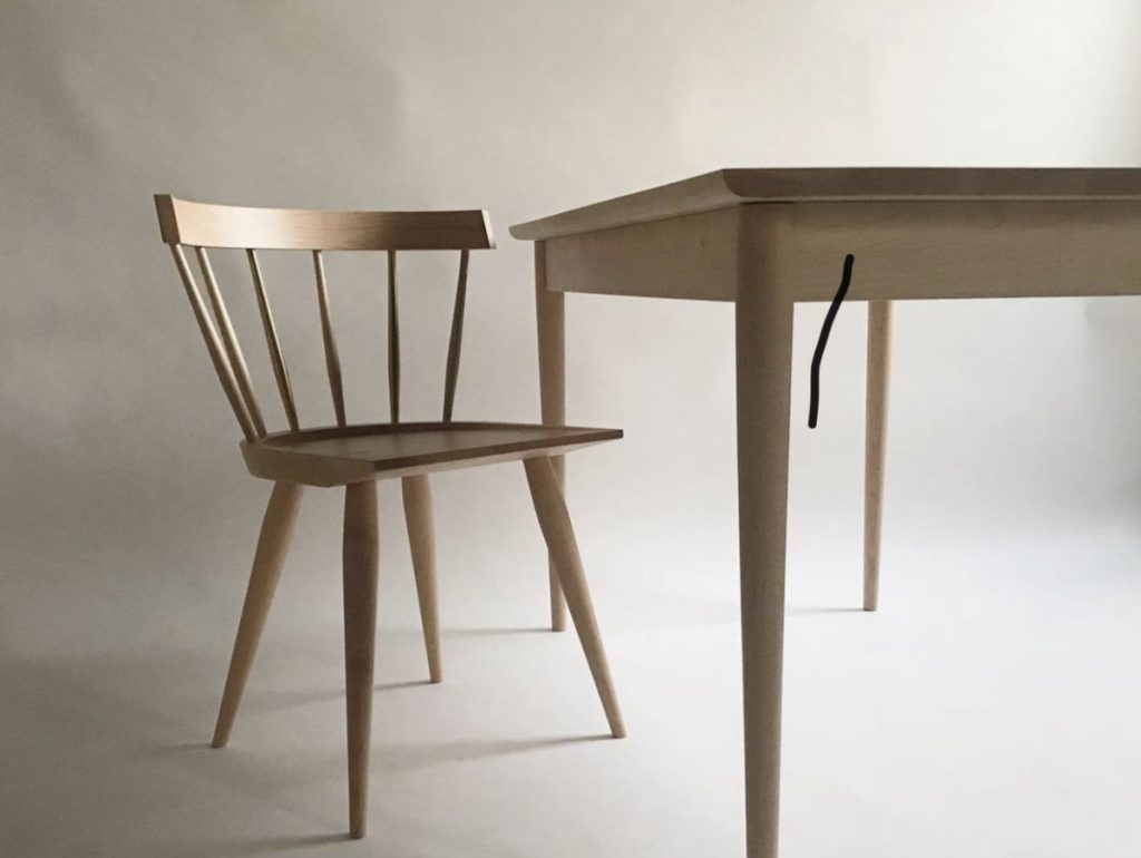 A table and chair made by Canadian Furniture Brand Coolican and Co.
